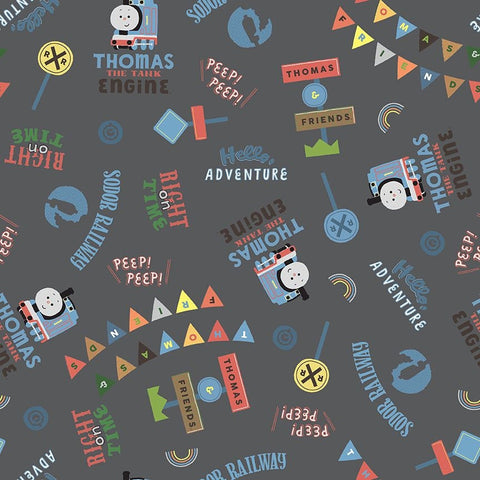 Image of the Thomas & Friends™ Sodor Railway Words Charcoal quilting cotton fabric by Riley Blake Designs. Features scattered trains, text, and icons on a grey background. 
Cute Little Fabric Shop