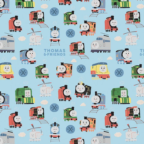 Image of the Thomas & Friends™ Sodor Railway Main Blue quilting cotton fabric by Riley Blake Designs. Features scattered trains, text, and icons on a light blue background. 
Cute Little Fabric Shop