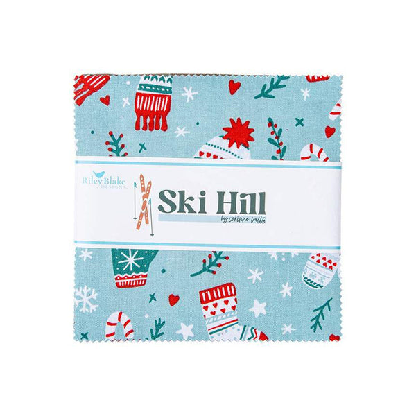 Image of the Ski Hill 5 inch Stacker by Corinne Wells for Riley Blake Designs. Features a main blue fabric with scattered coats, hats, mittens, and peppermints. 
Cute Little Fabric Shop