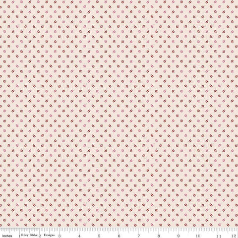 Image of the Home Town Holiday Delightful Latte by Riley Blake Designs. Features small geometric shapes on a light pink beige background. 
Cute Little Fabric Shop