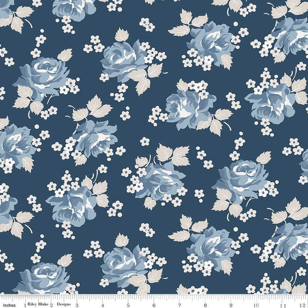 Image of the Serenity Blues Roses Navy quilting cotton fabric by Gerri Robinson. Features scattered roses and small blossoms on a dark navy blue background 
Cute Little Fabric Shop