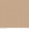 Image of the Home Town Holiday Mistletoe Tea Dye quilting cotton fabric by Riley Blake Designs. Features tossed sprigs and pin dots on a beige brown background. 
Cute Little Fabric Shop