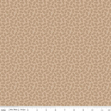 Image of the Home Town Holiday Mistletoe Tea Dye quilting cotton fabric by Riley Blake Designs. Features tossed sprigs and pin dots on a beige brown background. 
Cute Little Fabric Shop