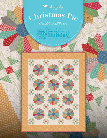 Image of the Christmas Pie Lori Holt Pattern from Riley Blake Designs. Pictures dresden blocks on a light background with a yellow border. 
Cute Little Fabric Shop