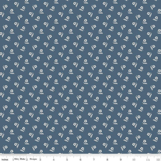 Image of the Serenity Blues Tiny Floral Navy quilting cotton fabric by Gerri Robinson for Riley Blake Designs. Features scattered blossoms and sprigs of leaves on a dark blue background. 
Cute Little Fabric Shop
