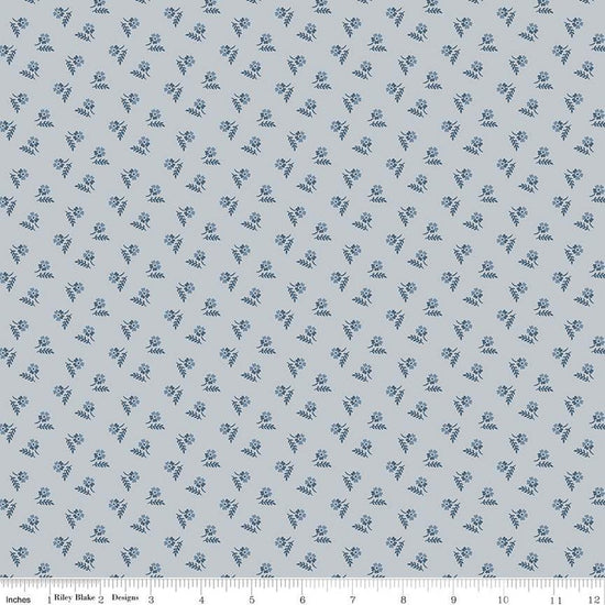 Image of the Serenity Blues Tiny Floral Gray quilting cotton fabric by Gerri Robinson for Riley Blake Designs. Features scattered blossoms and sprigs of leaves on a light gray background. 
Cute Little Fabric Shop