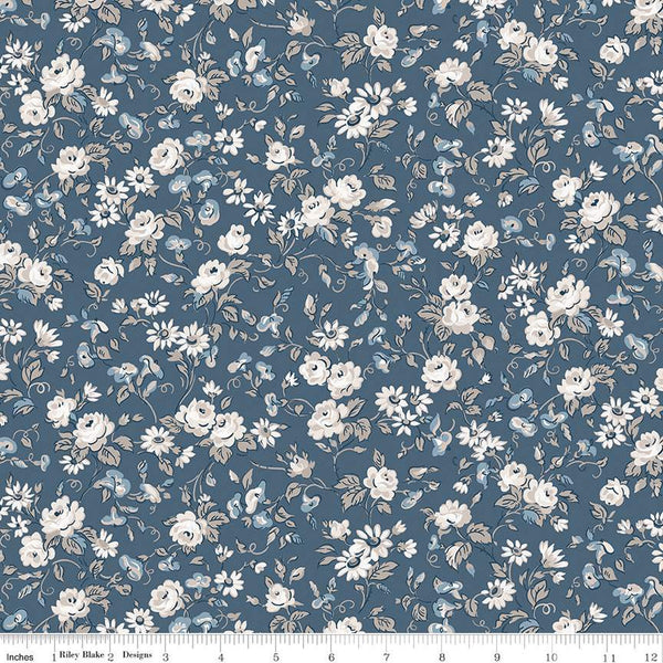 Image of the Serenity Blues Flower Toss Denim quilting cotton fabric by Gerri Robinson for Riley Blake Designs. Features tossed sprigs of flowers and leaves on a denim blue background. 
Cute Little Fabric Shop