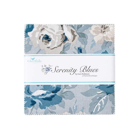 Image of the Serenity Blues 5 inch stacker by Gerri Robinson for Riley Blake Designs. Pictures the main grey fabric with large blue and white roses on a grey background. 
Cute Little Fabric Shop