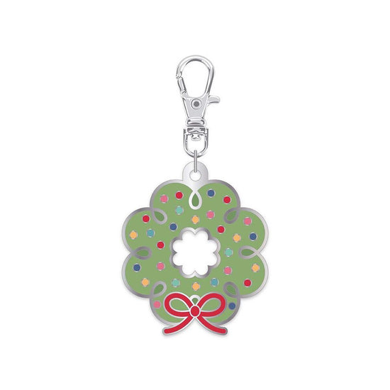 Image of the Lori Holt Enamel Happy Charm™ Wreath by Riley Blake Designs. Features a green wreath with colorful dots and a red bow. 
Cute Little Fabric Shop