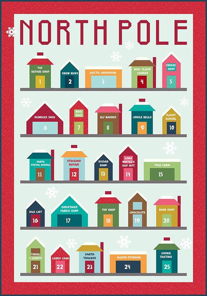 Image of Jennifer Long North Pole Village Advent Calendar Quilt Pattern by Riley Blake Designs. Features houses on a light blue background. 
Cute Little Fabric Shop