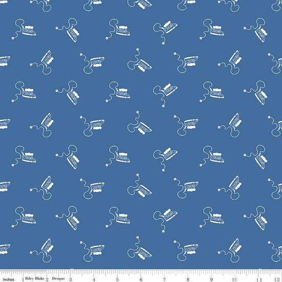 Image of the Press On Mini Irons Denim quilting cotton fabric by J. Wecker Frisch for Riley Blake Designs. Features scattered mini irons on a blue background. 
Cute Little Fabric Shop