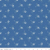 Image of the Press On Mini Irons Denim quilting cotton fabric by J. Wecker Frisch for Riley Blake Designs. Features scattered mini irons on a blue background. 
Cute Little Fabric Shop