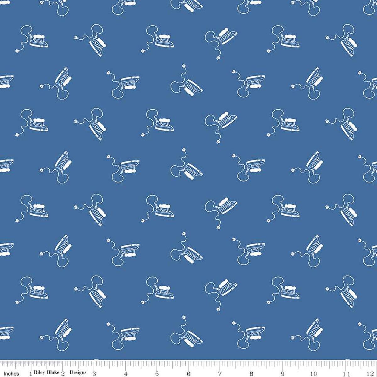 Image of the Press On Mini Irons Denim quilting cotton fabric by J. Wecker Frisch for Riley Blake Designs. Features scattered mini irons on a blue background. 
Cute Little Fabric Shop
