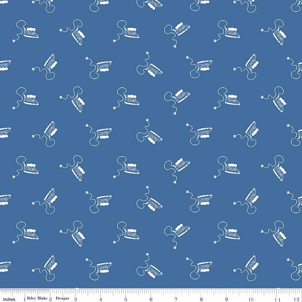 Image of the Press On Mini Irons Denim quilting cotton fabric by J. Wecker Frisch for Riley Blake Designs. Features scattered mini irons on a blue background. 
Cute Little Fabric Shop