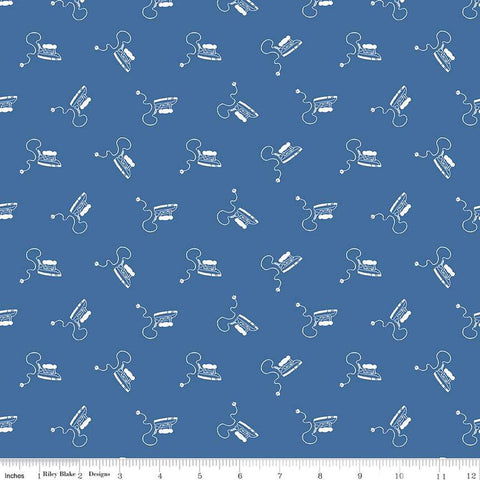 Image of the Press On Mini Irons Denim quilting cotton fabric by J. Wecker Frisch for Riley Blake Designs. Features scattered mini irons on a blue background. 
Cute Little Fabric Shop