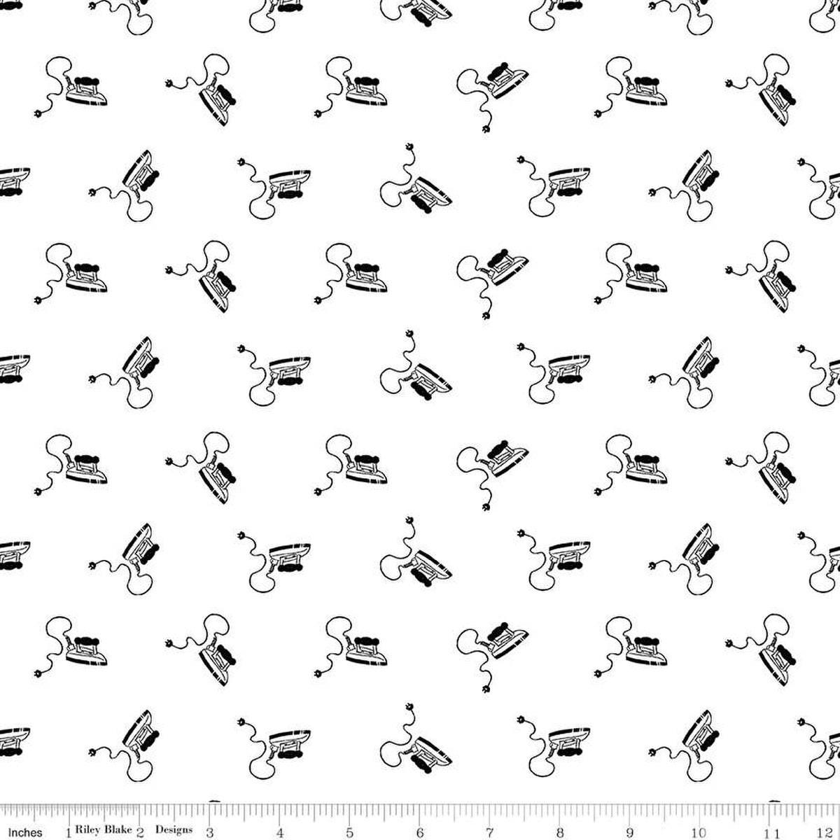 Image of the Press On Mini Irons Black quilting cotton fabric by J. Wecker Frisch for Riley Blake Designs. Features scattered mini irons on a white background. 
Cute Little Fabric Shop