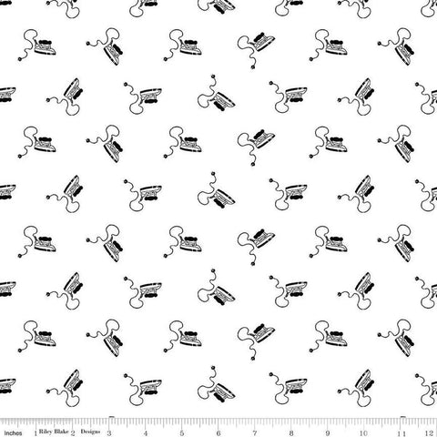 Image of the Press On Mini Irons Black quilting cotton fabric by J. Wecker Frisch for Riley Blake Designs. Features scattered mini irons on a white background. 
Cute Little Fabric Shop