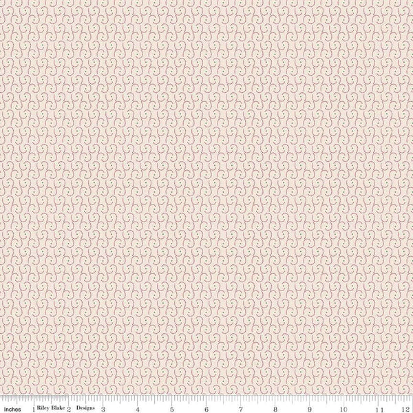 Image of the Home Town Holiday Swirl Latte by Riley Blake Designs. Features dotted swirls and pink dots on a light pink beige background. 
Cute Little Fabric Shop