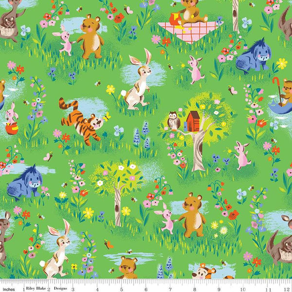 Image of the 100 Aker Woods Main Green quilting cotton fabric by Jill Howarth for Riley Blake Designs. Features characters from Winnie the Pooh in a forest setting with trees and flowers on a bright green background. 
Cute Little Fabric Shop