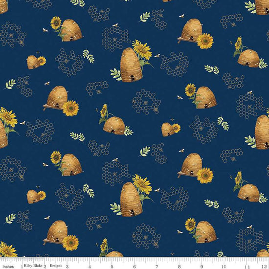 Image of the Honey Bees and Flowers Please Beehives Navy quilting cotton fabric by Tara Reed for Riley Blake Designs. Features  beehives, bees, honeycomb, and sunflowers on a navy blue background. 
Cute Little Fabric Shop