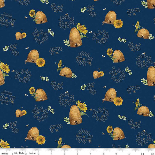 Image of the Honey Bees and Flowers Please Beehives Navy quilting cotton fabric by Tara Reed for Riley Blake Designs. Features  beehives, bees, honeycomb, and sunflowers on a navy blue background. 
Cute Little Fabric Shop