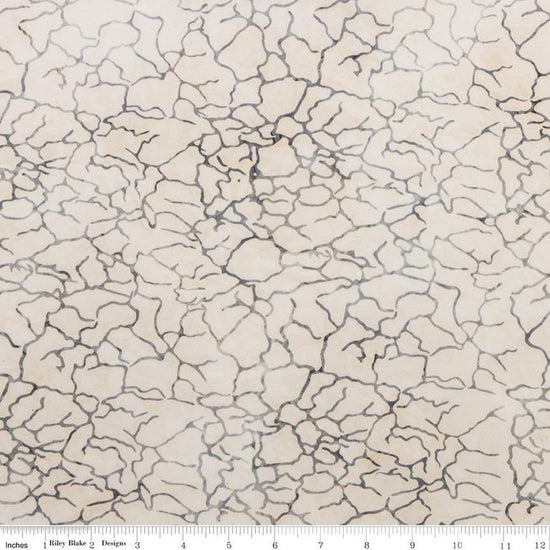 Image of the Expressions Batiks Breathe Beau fabric by Riley Blake Designs. Features a light tan fabric with fissure patterns. 
Cute Little Fabric Shop