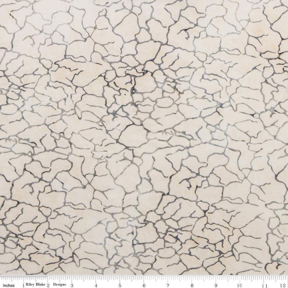 Image of the Expressions Batiks Breathe Beau fabric by Riley Blake Designs. Features a light tan fabric with fissure patterns. 
Cute Little Fabric Shop