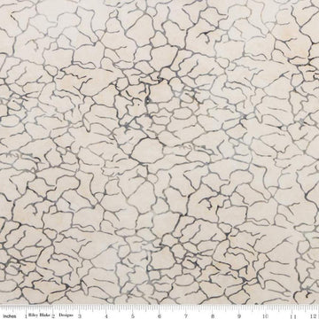 Image of the Expressions Batiks Breathe Beau fabric by Riley Blake Designs. Features a light tan fabric with fissure patterns. 
Cute Little Fabric Shop