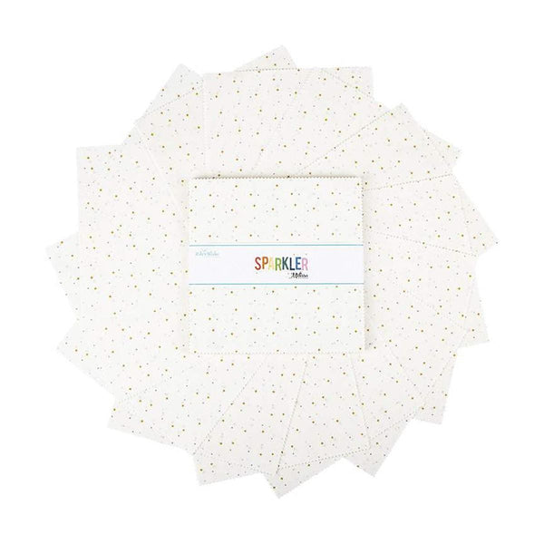 Image of the Sparkler 10&quot; White Stacker by Melissa Mortenson for Riley Blake Designs. Features small gold crosses on a white background. 
Cute Little Fabric Shop