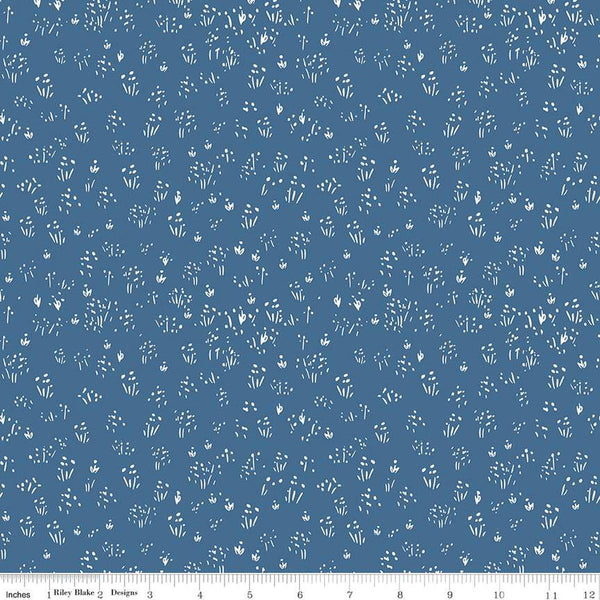 Image of the Farm Livin Grass Denim quilting cotton fabric by Riley Blake Designs. Features scattered grass on a blue background. 
Cute Little Fabric Shop