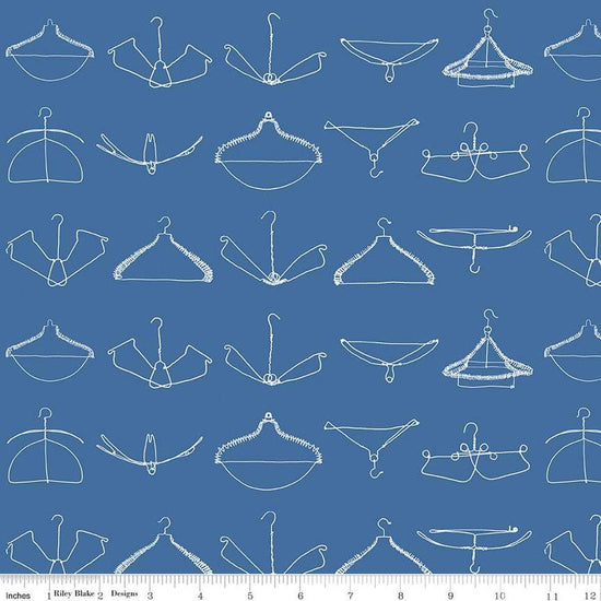 Image of the Press On Wire Hangers Blue quilting cotton fabric by J. Wecker Frisch for Riley Blake Designs. Features scattered wire clothes hangers on a blue background. 
Cute Little Fabric Shop