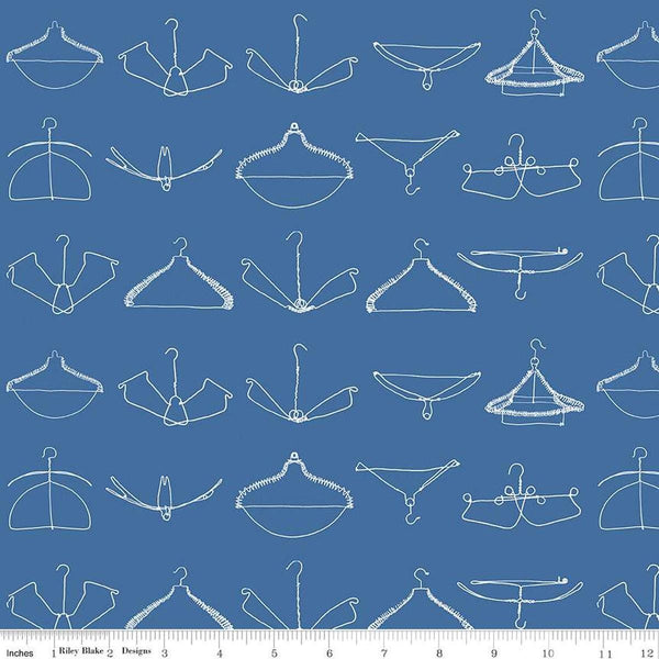 Image of the Press On Wire Hangers Blue quilting cotton fabric by J. Wecker Frisch for Riley Blake Designs. Features scattered wire clothes hangers on a blue background. 
Cute Little Fabric Shop