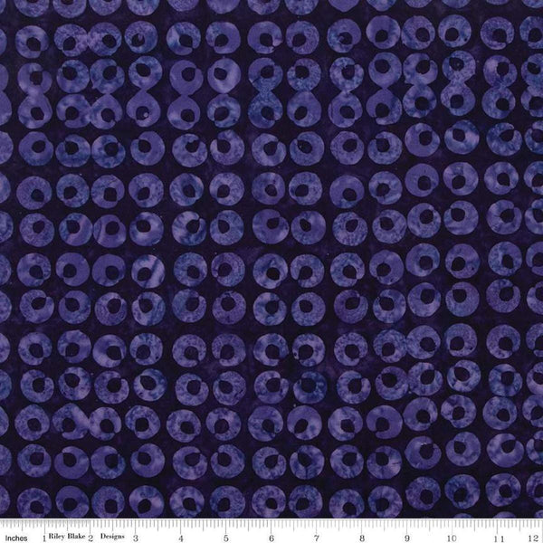 Image of the Expressions Batiks Halloween Expressions Blackberry quilting cotton fabric by Riley Blake Designs. Features circles on a dark purple background. 
Cute Little Fabric Shop