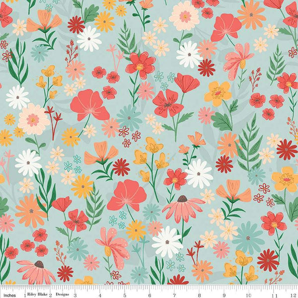 Image of the Stay Wild Main Mist quilting cotton fabric by Amanda Niederhauser by Riley Blake Designs. Features  wildflowers on a light blue background. 
Cute Little Fabric Shop