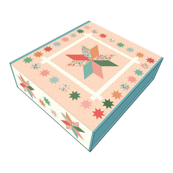 Image of the Primrose Star Quilt Boxed Kit featuring fabric from the Stay Wild collection by Amanda Niederhauser for Riley Blake Designs. Features a light pink background with a large star bordered by small stars. 
Cute Little Fabric Shop