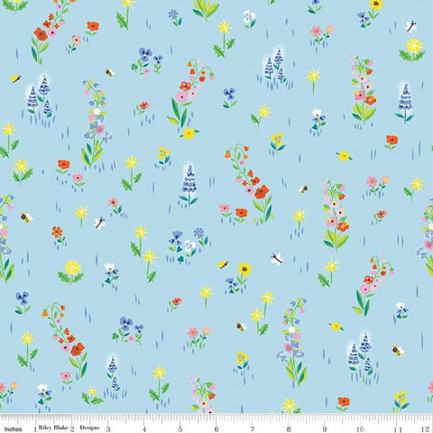 Image of the 100 Aker Woods Picnic Meadow Sky quilting cotton fabric by Jill Howarth for Riley Blake Designs. Features flowers with bees and butterflies on a blue background. 
Cute Little Fabric Shop