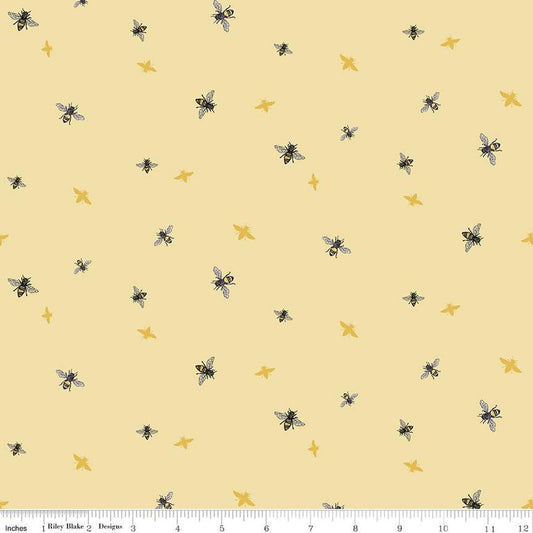 Image of the Honey Bees and Flowers Please Bees Yellow quilting cotton fabric by Tara Reed for Riley Blake Designs. Features small bees scattered on a light yellow background. 
Cute Little Fabric Shop