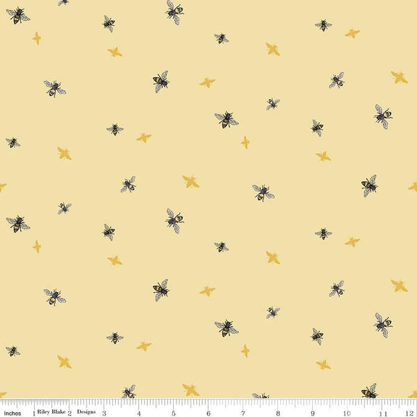 Image of the Honey Bees and Flowers Please Bees Yellow quilting cotton fabric by Tara Reed for Riley Blake Designs. Features small bees scattered on a light yellow background. 
Cute Little Fabric Shop