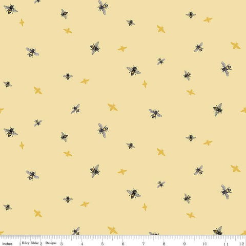 Image of the Honey Bees and Flowers Please Bees Yellow quilting cotton fabric by Tara Reed for Riley Blake Designs. Features small bees scattered on a light yellow background. 
Cute Little Fabric Shop