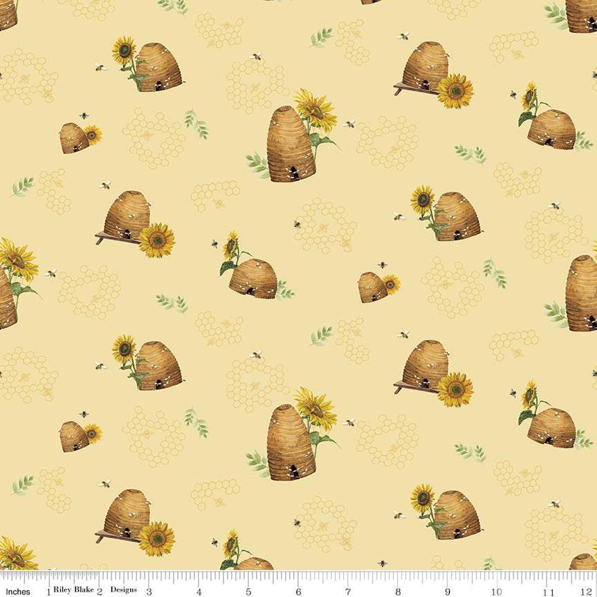 Image of the Honey Bees and Flowers Please Beehives Yellow quilting cotton fabric by Tara Reed for Riley Blake Designs. Features  beehives, bees, honeycomb, and sunflowers on a yellow background. 
Cute Little Fabric Shop