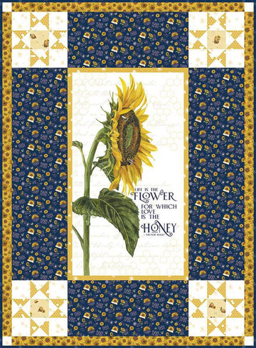 Image of the Life Is the Flower Panel Boxed Quilt Kit by Tara Reed for Riley Blake Designs. Features a large sunflower in the center with coordinating navy and yellow fabrics on the side. 
Cute Little Fabric Shop