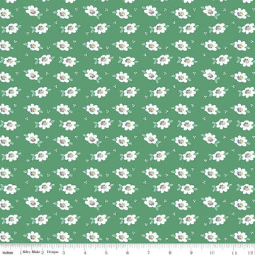 Image of the Always in Season Daisy Green quilting cotton fabric by American Jane for Riley Blake Designs. Features scattered blossoms and dots on a green background. 
Cute Little Fabric Shop