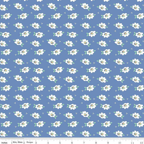 Image of the Always in Season Daisy Blueberry quilting cotton fabric by American Jane for Riley Blake Designs. Features scattered blossoms and dots on a blue background. 
Cute Little Fabric Shop