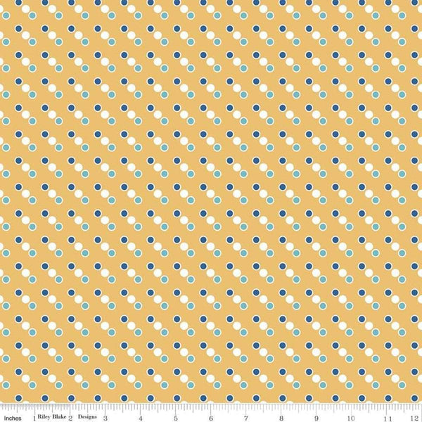 Image of the Cozy Christmas Dot Yellow fabric by Riley Blake Designs. Features features a diagonal dot pattern on a yellow background. 
Cute Little Fabric Shop