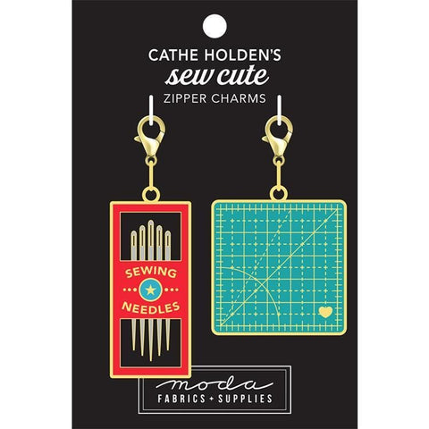 Image of the Sew Cute Zipper Charms by Cathe Holden for Moda Fabrics. Features a sewing needle charm and a cutting mat charm. 
Cute Little Fabric Shop