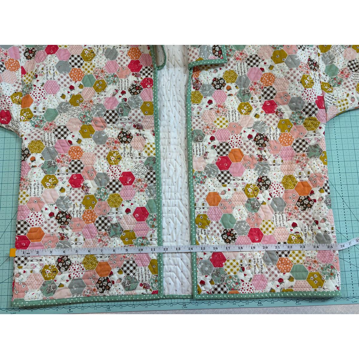 Image of the Quilted Jacket Pattern by Paula McKinlay and Claire Root. Features a jacket with a quilted pattern and a measuring tape showing that it is 15.75 inches wide. 
Cute Little Fabric Shop