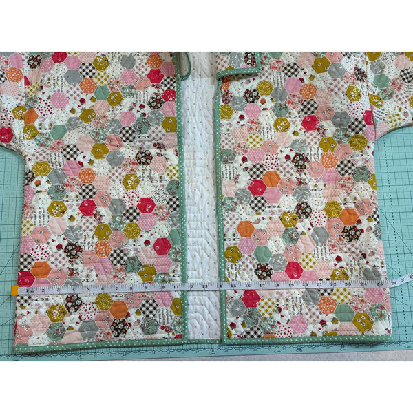 Image of the Quilted Jacket Pattern by Paula McKinlay and Claire Root. Features a jacket with a quilted pattern and a measuring tape showing that it is 15.75 inches wide. 
Cute Little Fabric Shop