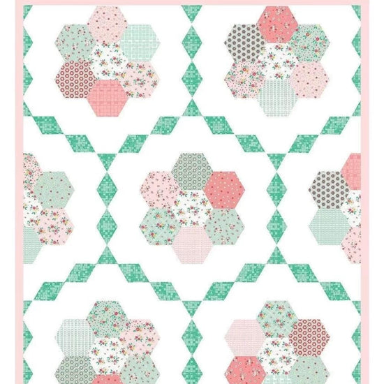 Image of the Vintage Garden quilt pattern by Beverly McCullough for Riley Blake Designs. Features hexagons in circles on a white background. 
Cute Little Fabric Shop