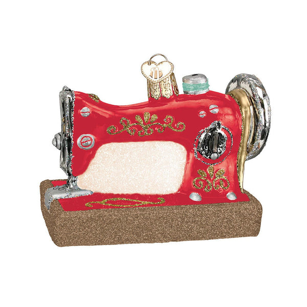 Image of the Lori Holt Home Town Holiday Christmas Ornament by Lori Holt. Features a glass sewing machine. 
Cute Little Fabric Shop