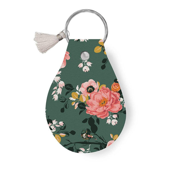 Image of the Leather Circle Key Chain Porch Swing by Ashley Collett for Riley Blake Designs. Features a pink flower design on a full grain leather keychain with tassle. 
Cute Little Fabric Shop